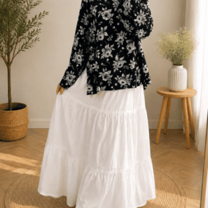 black floral top with white tiered maxi skirt